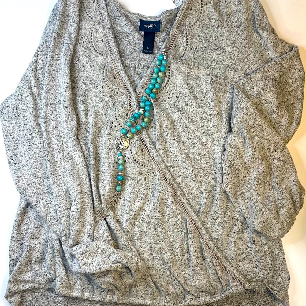 Long sleeve gray knit sweater top with great eyelet detail. Soft, relaxed fit.
